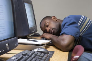 Student sleeping in computer lab