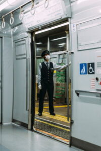 Conductor on train with mask