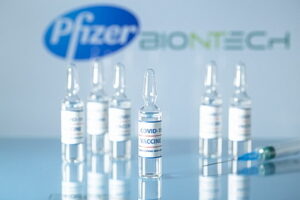 Pfizer And Biontech Vaccine Against Covid-19. Glass Medical Vial