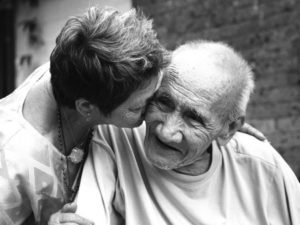 Woman Taking Care of an Elderly Man