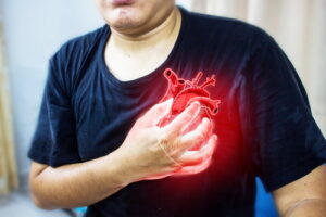 Man clutching his chest from acute pain.