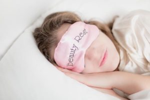 Woman sleeping with blindfold