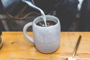 Coffee being poured into a cup