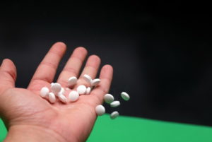 pills in human hand