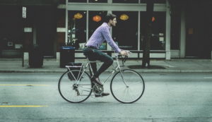 Man bicycle riding on a city street