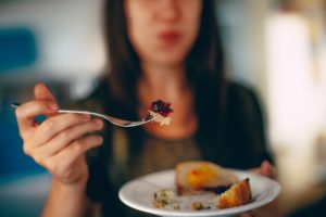 Woman eating unhealthy