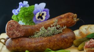 Possessed sausage on a table