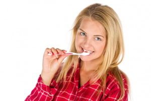 Woman brushing her teeth