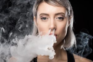 Woman using a vape cigarette