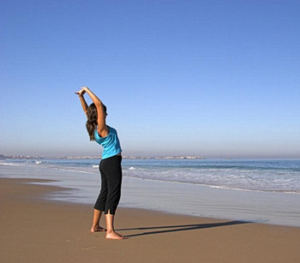 Woman exercising on the beach