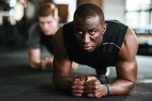 Two Men Exercising on Mat