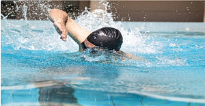 Man swimming in swimming pool