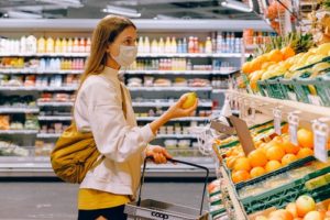 Woman purchasing food during the COVID pandemic