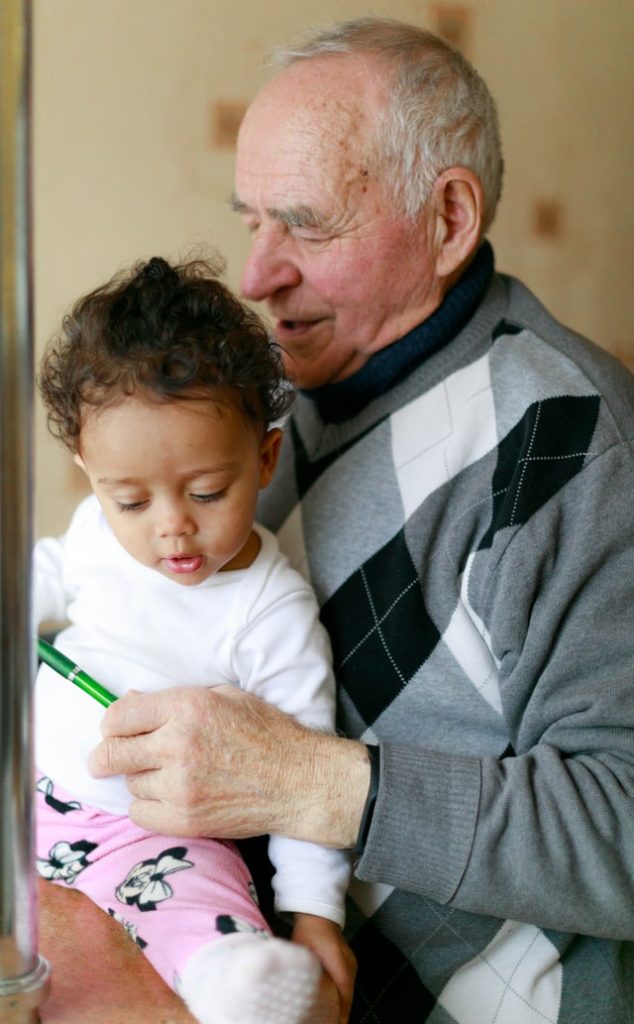 Older man with young child