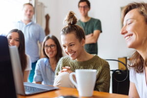 Happy people at a computer